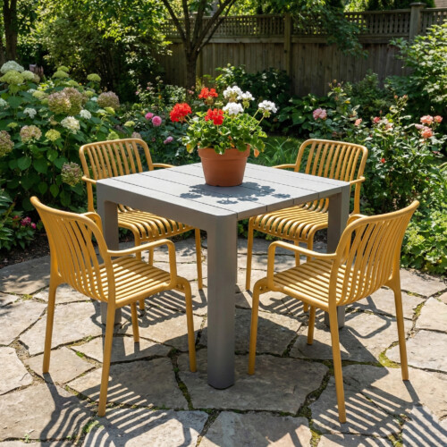 Henrik 100 Dining Table Nickel Grey With 4 Alma Armchair Saffron Set picture 01 a garden lifestyle image